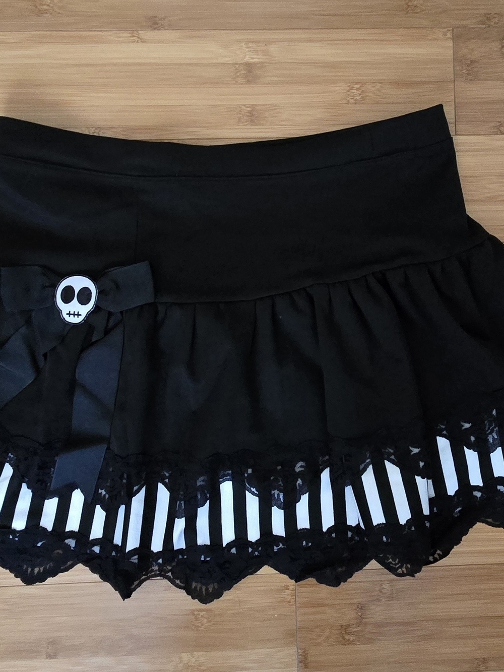 Black Gothic Mini Skirt with Skull Bow Accent